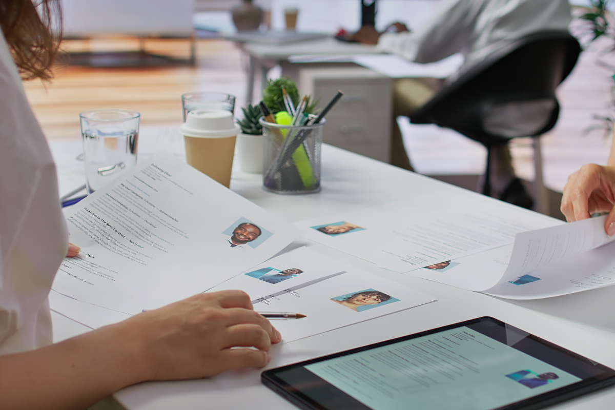 HR professional reviewing secure employee records on a laptop in an office, illustrating HR data privacy practices.